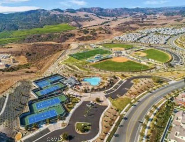 birds eye view of property featuring a mountain view