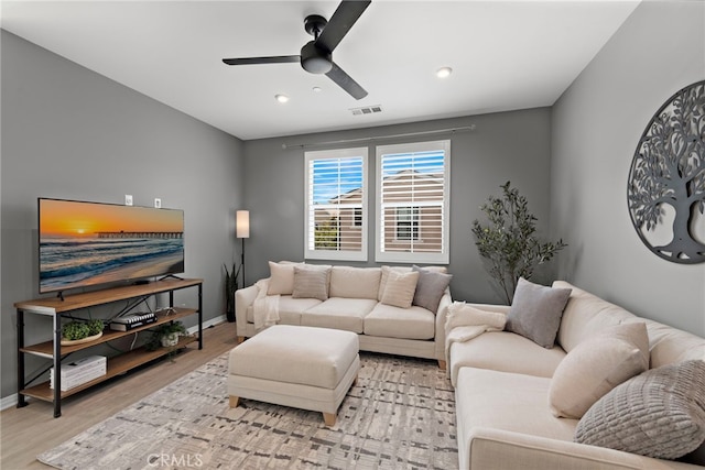 living area featuring recessed lighting, wood finished floors, visible vents, a ceiling fan, and baseboards