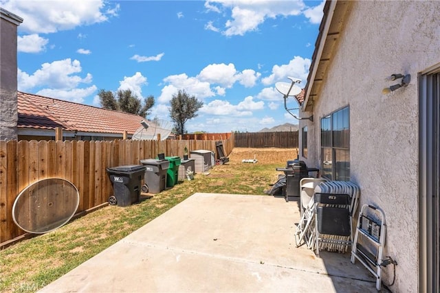 25448 Wedmore Dr, Moreno Valley, CA 92553 - view of patio with grilling area and a fenced backyard
