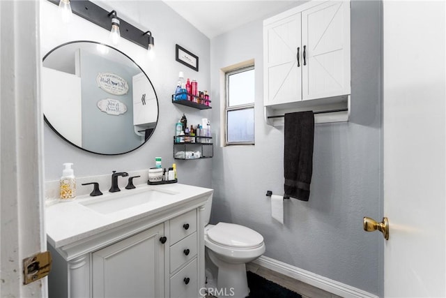 25448 Wedmore Dr, Moreno Valley, CA 92553 - bathroom with toilet, vanity, and baseboards