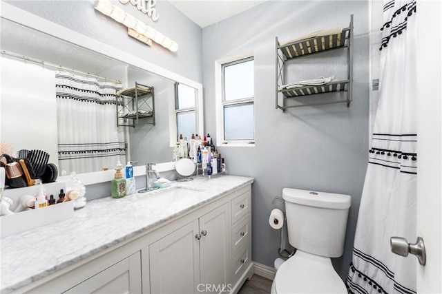 25448 Wedmore Dr, Moreno Valley, CA 92553 - full bath with a shower with shower curtain, toilet, and vanity