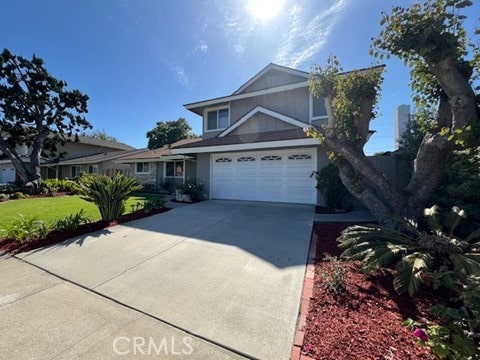 16591 Busby Ln, Huntington Beach, CA 92647 - traditional-style house with concrete driveway, a garage, and a front lawn