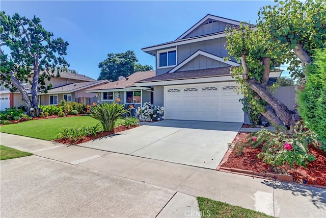 16591 Busby Ln, Huntington Beach, CA 92647 - view of front facade featuring concrete driveway, a garage, and a front yard