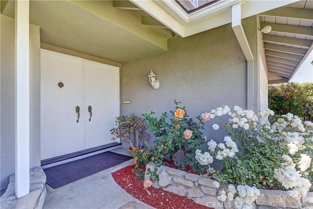 16591 Busby Ln, Huntington Beach, CA 92647 - view of exterior entry featuring stucco siding