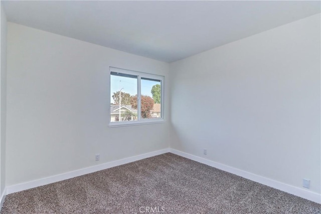 16591 Busby Ln, Huntington Beach, CA 92647 - empty room featuring carpet and baseboards