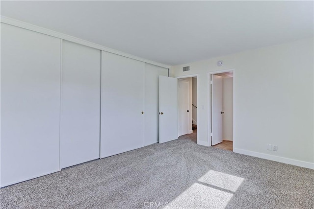 16591 Busby Ln, Huntington Beach, CA 92647 - unfurnished bedroom featuring carpet flooring, a closet, and baseboards