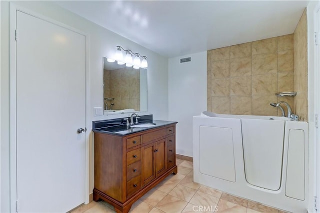 16591 Busby Ln, Huntington Beach, CA 92647 - full bathroom featuring a garden tub, vanity, and tile patterned flooring