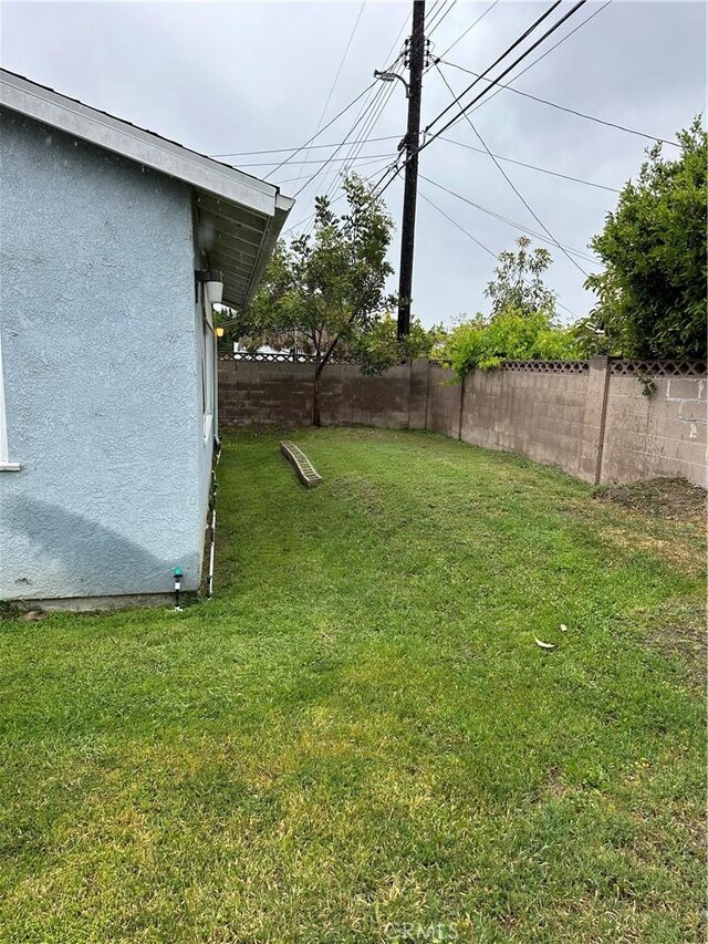 view of yard with a fenced backyard
