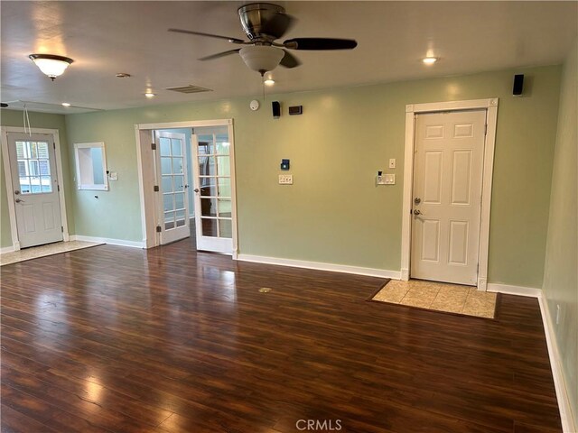 entryway with visible vents, wood finished floors, and baseboards