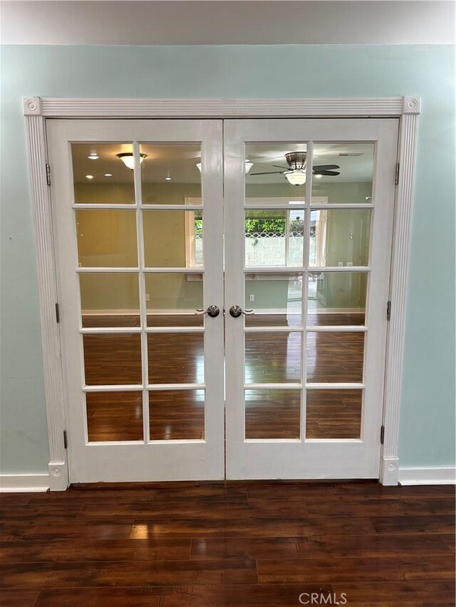 doorway to outside featuring ceiling fan, baseboards, french doors, and dark wood-type flooring