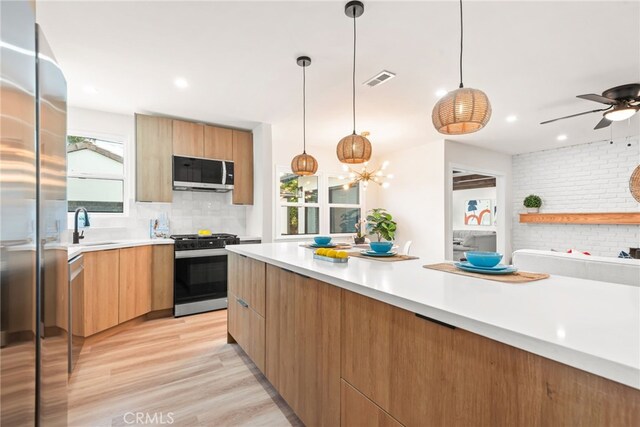 2430 Van Wick St, Inglewood, CA 90303 - kitchen with stainless steel appliances, plenty of natural light, modern cabinets, and a sink