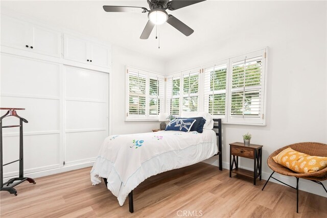 2430 Van Wick St, Inglewood, CA 90303 - bedroom with a ceiling fan, light wood-style flooring, and multiple windows