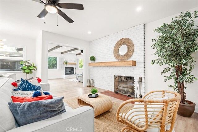 2430 Van Wick St, Inglewood, CA 90303 - living area featuring recessed lighting, wood finished floors, ceiling fan, and a brick fireplace