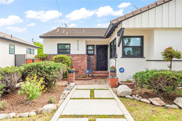 2430 Van Wick St, Inglewood, CA 90303 - doorway to property with stucco siding and stone siding