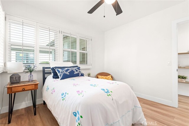 2430 Van Wick St, Inglewood, CA 90303 - bedroom with baseboards, wood finished floors, and ceiling fan