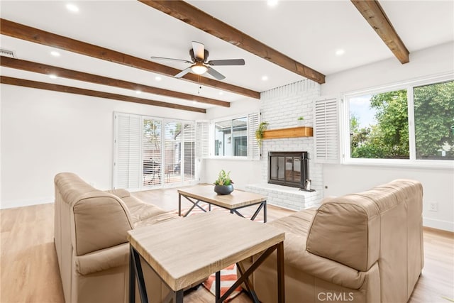 2430 Van Wick St, Inglewood, CA 90303 - living area featuring baseboards, light wood-type flooring, a ceiling fan, and a healthy amount of sunlight