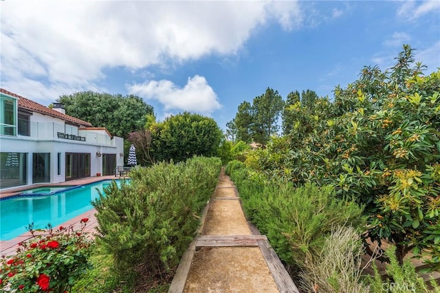 pool featuring an in ground hot tub