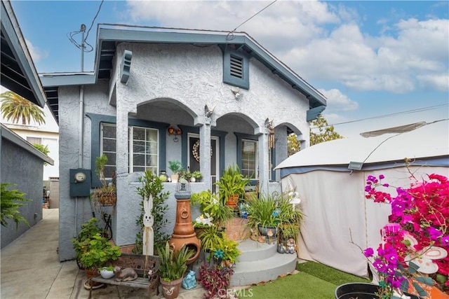 1843 Cerritos Ave, Long Beach, CA 90806 - view of front facade with stucco siding, an outdoor structure, and a shed