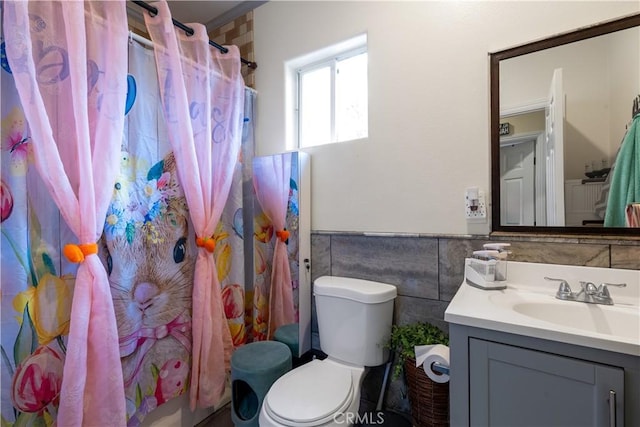 1843 Cerritos Ave, Long Beach, CA 90806 - full bath featuring tile walls, vanity, toilet, wainscoting, and a shower with curtain