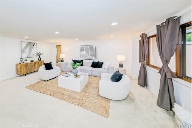 living area with recessed lighting and baseboards