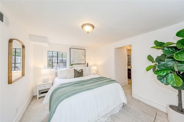 bedroom with baseboards, carpet, arched walkways, and visible vents