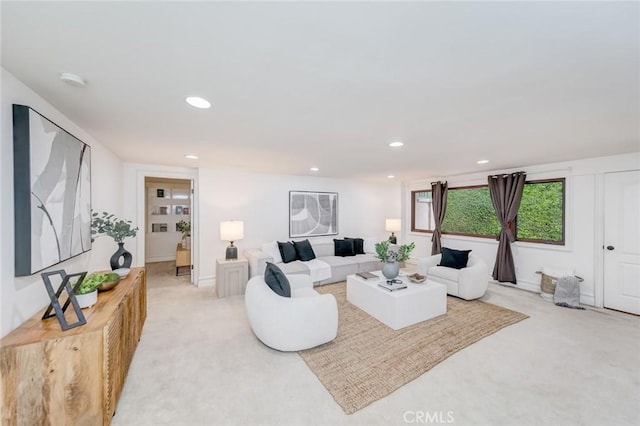 living room featuring recessed lighting and light carpet