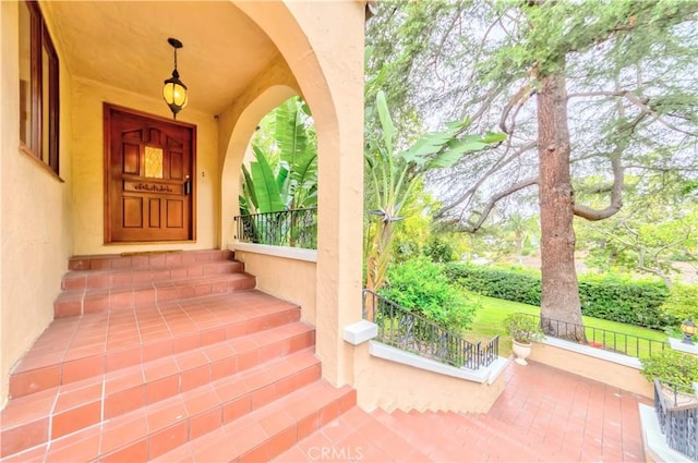 516 Orange Grove Ave, South Pasadena, CA 91030 - view of exterior entry with stucco siding and a porch