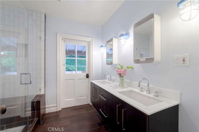 516 Orange Grove Ave, South Pasadena, CA 91030 - full bath with a sink, wood tiled floor, a shower stall, and double vanity