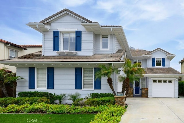 4505 Cresta Babia, San Clemente, CA 92673 - view of front of home featuring driveway, a tiled roof, and an attached garage