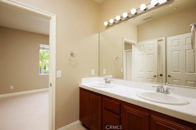 4505 Cresta Babia, San Clemente, CA 92673 - bathroom with double vanity and baseboards