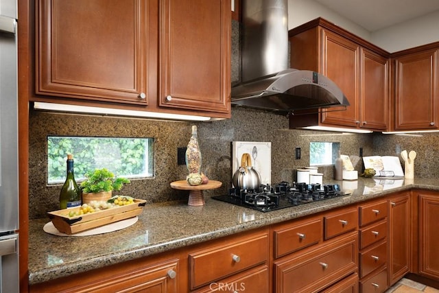 4505 Cresta Babia, San Clemente, CA 92673 - kitchen featuring wall chimney exhaust hood, black gas cooktop, stone countertops, backsplash, and brown cabinets