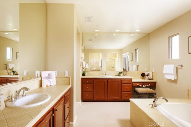 4505 Cresta Babia, San Clemente, CA 92673 - full bathroom with a bath, two vanities, a shower stall, and recessed lighting