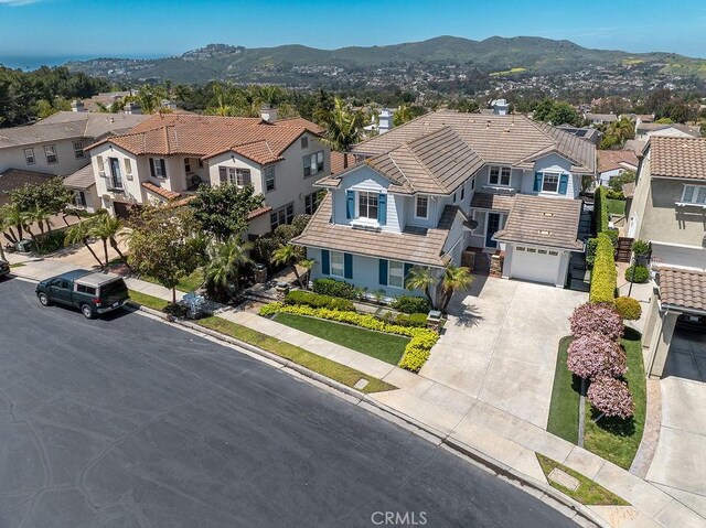 4505 Cresta Babia, San Clemente, CA 92673 - view of front facade featuring a tile roof, a residential view, driveway, and a mountain view