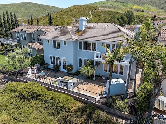 4505 Cresta Babia, San Clemente, CA 92673 - rear view of property with stucco siding, a balcony, a fenced backyard, and a patio