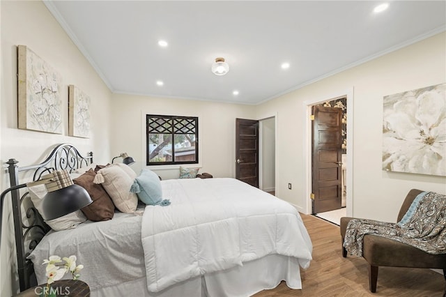 bedroom with light wood finished floors, recessed lighting, and crown molding