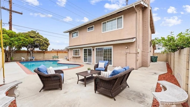 16001 Ballantine Ln, Huntington Beach, CA 92647 - back of house featuring stucco siding, a fenced backyard, and a patio