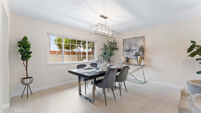 16001 Ballantine Ln, Huntington Beach, CA 92647 - dining room with wood finished floors and a chandelier