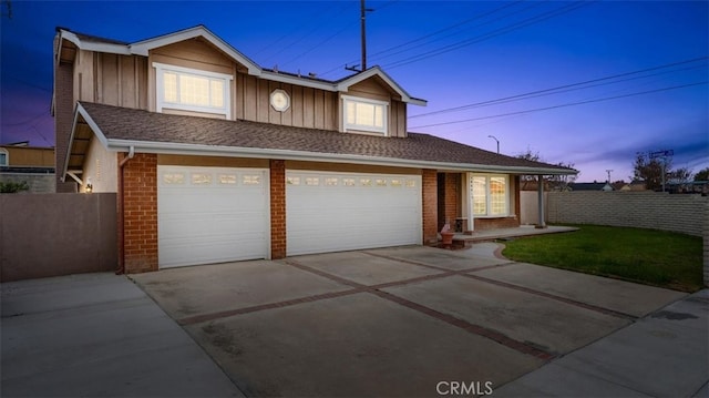 16001 Ballantine Ln, Huntington Beach, CA 92647 - traditional-style home featuring concrete driveway, a garage, brick siding, and board and batten siding