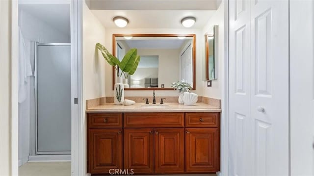 16001 Ballantine Ln, Huntington Beach, CA 92647 - full bathroom with vanity, a shower stall, and a closet