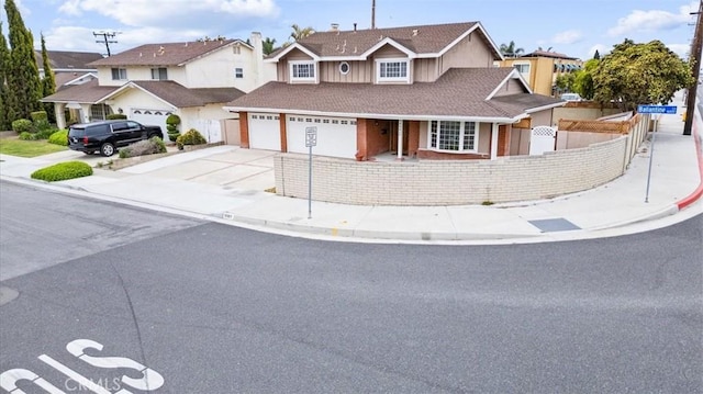 16001 Ballantine Ln, Huntington Beach, CA 92647 - traditional-style home featuring concrete driveway, a garage, and a residential view