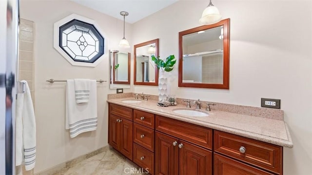 16001 Ballantine Ln, Huntington Beach, CA 92647 - bathroom with double vanity and baseboards
