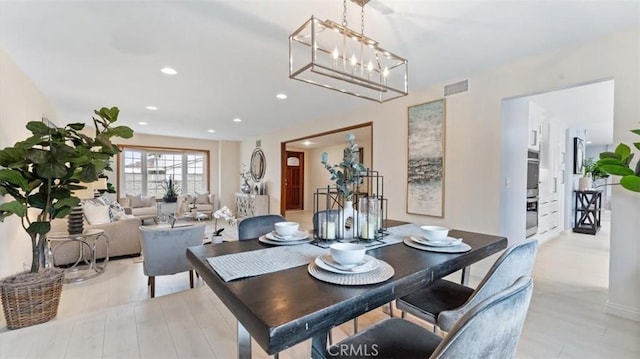 16001 Ballantine Ln, Huntington Beach, CA 92647 - dining room with recessed lighting, light wood-style floors, and a chandelier