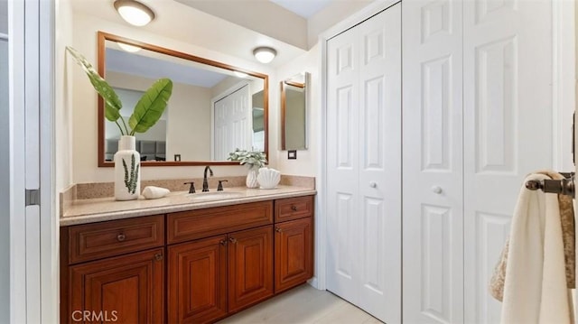 16001 Ballantine Ln, Huntington Beach, CA 92647 - bathroom with a closet, vanity, and tile patterned flooring