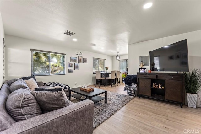 11415 216th St Unit 24, Lakewood, CA 90715 - living room featuring recessed lighting, light wood-style flooring, visible vents, and a healthy amount of sunlight