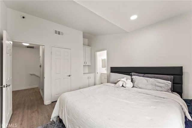 11415 216th St Unit 24, Lakewood, CA 90715 - bedroom featuring recessed lighting, vaulted ceiling, visible vents, wood finished floors, and baseboards