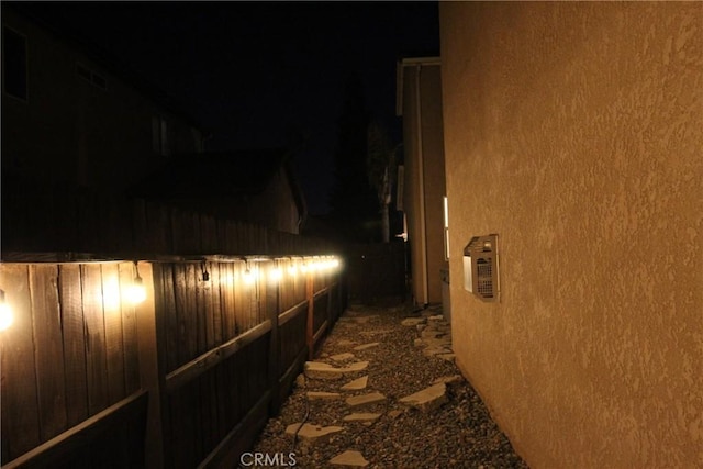 2653 Ashcroft Ave, Clovis, CA 93611 - property exterior at night featuring stucco siding and a fenced backyard