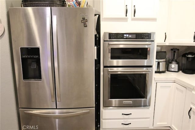 2653 Ashcroft Ave, Clovis, CA 93611 - kitchen featuring white cabinetry, appliances with stainless steel finishes, and light countertops