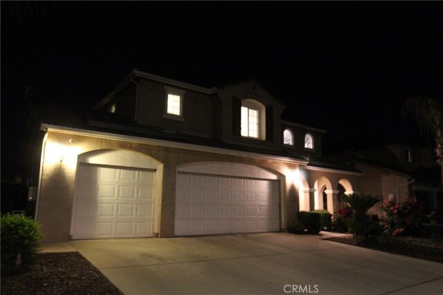 2653 Ashcroft Ave, Clovis, CA 93611 - traditional home with stucco siding, driveway, and an attached garage