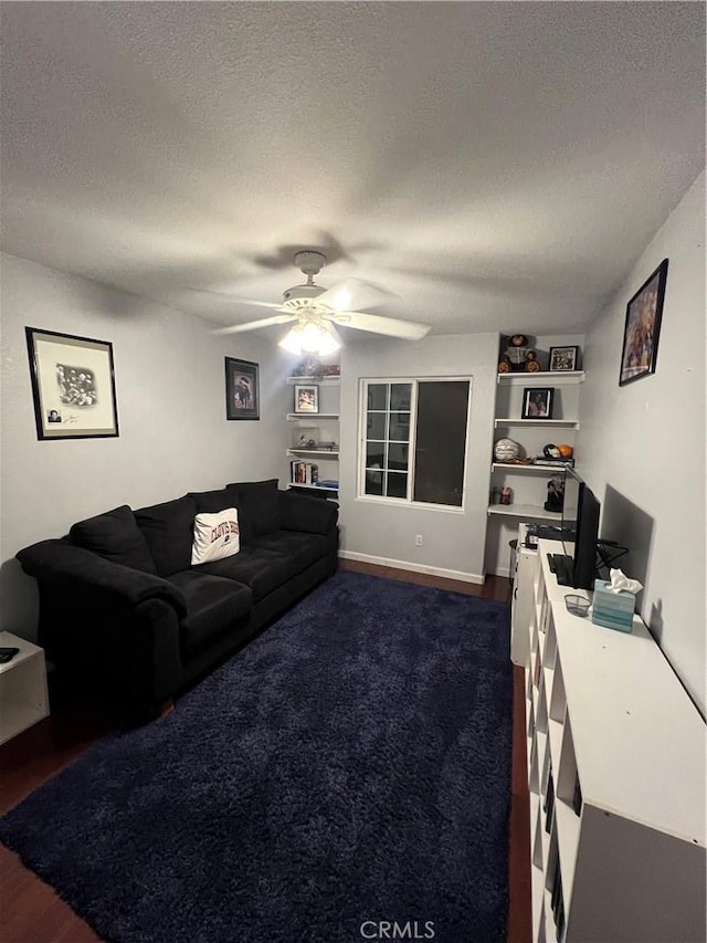 2653 Ashcroft Ave, Clovis, CA 93611 - living area with a textured ceiling, a ceiling fan, built in features, and dark wood-type flooring
