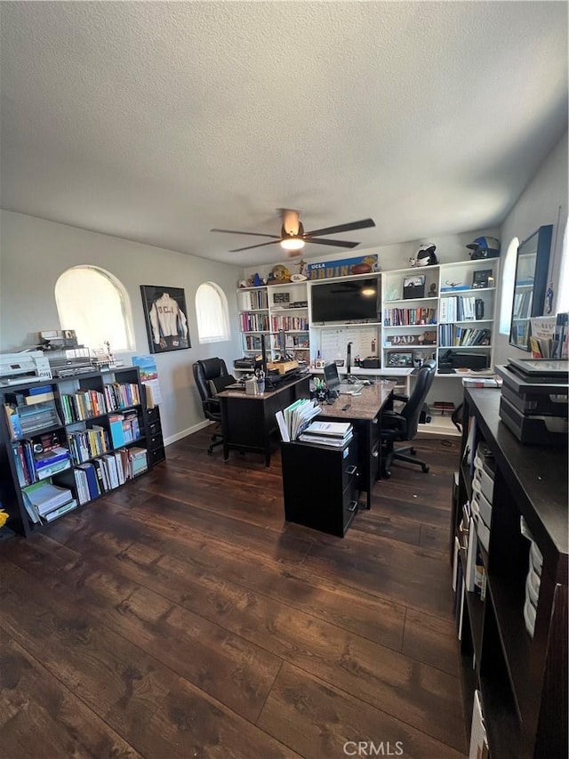 2653 Ashcroft Ave, Clovis, CA 93611 - home office featuring a textured ceiling, dark wood-style flooring, and ceiling fan